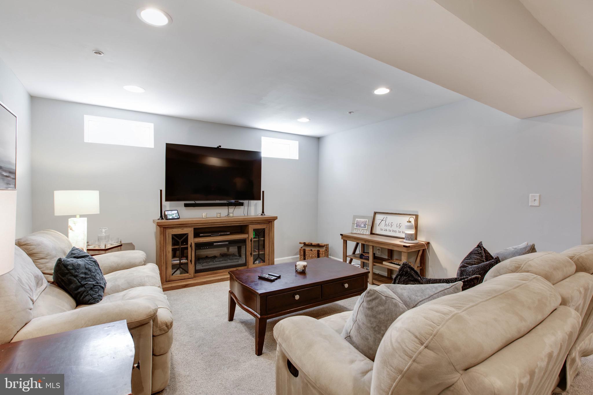7870 Sunhaven Way Severn, MD 21144 - Photo 55 of 70 a living room with furniture and a flat screen tv
