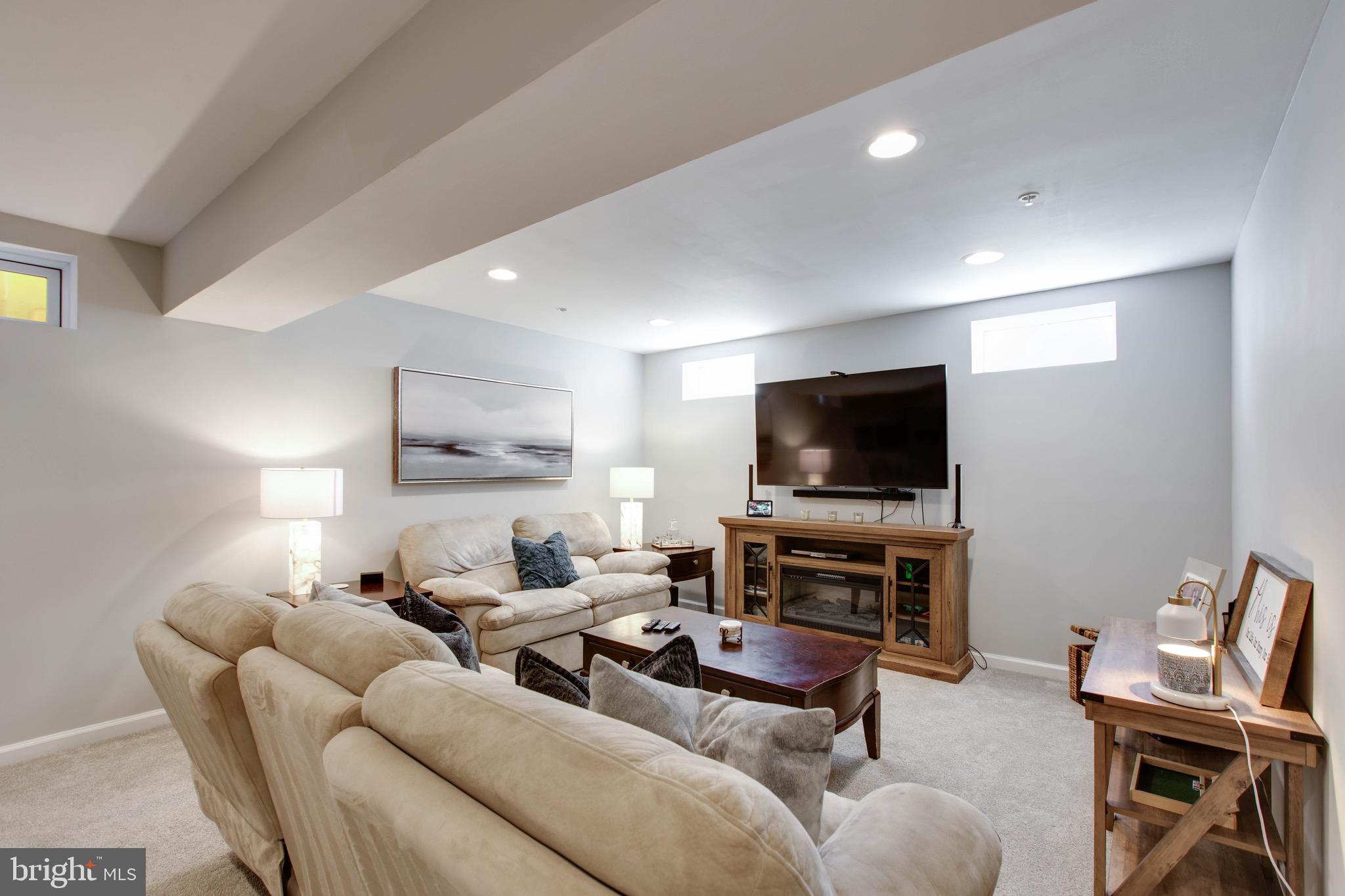 7870 Sunhaven Way Severn, MD 21144 - Photo 56 of 70 a living room with furniture and a flat screen tv