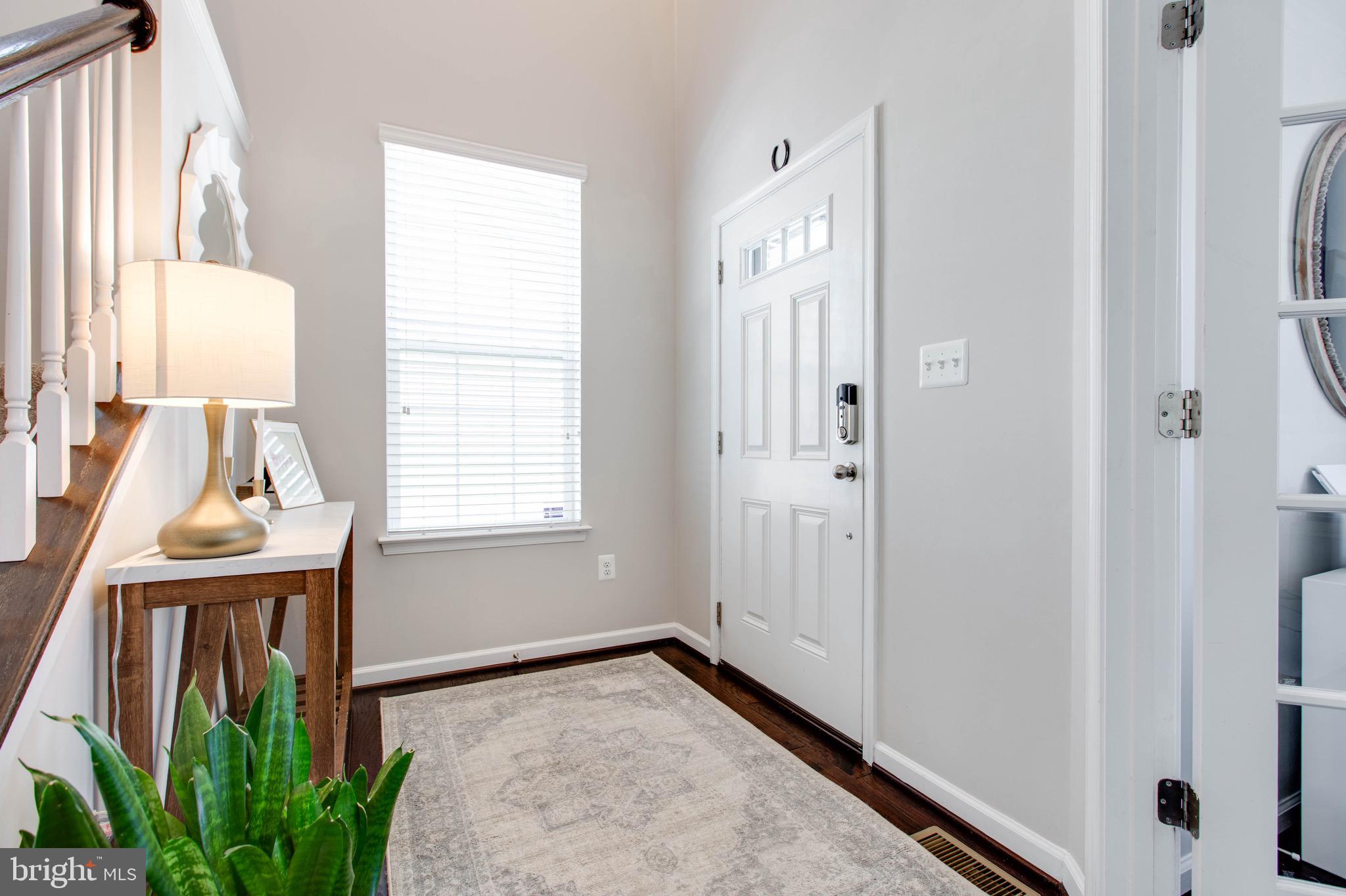 7870 Sunhaven Way Severn, MD 21144 - Photo 6 of 70 a view of front door with furniture and a window