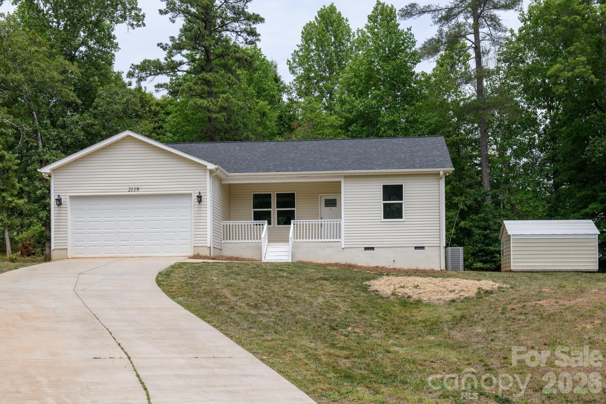 2119 South Road Morganton, NC 28655 - Photo 2 of 47 a front view of a house with a garden and yard