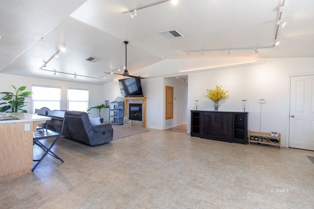 6542 Ridgecrest Boulevard Inyokern, CA 93527 - Photo 9 of 50 a living room with furniture and a chandelier