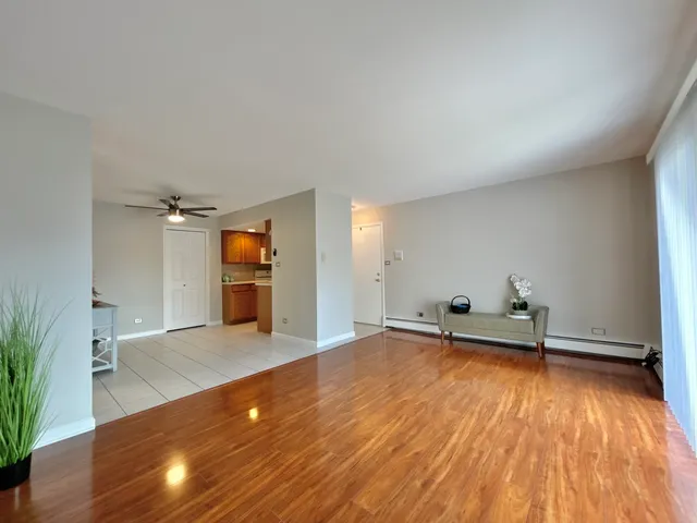 a view of a room with wooden floor