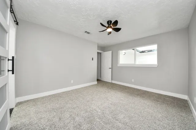 a view of a kitchen with microwave and cabinets
