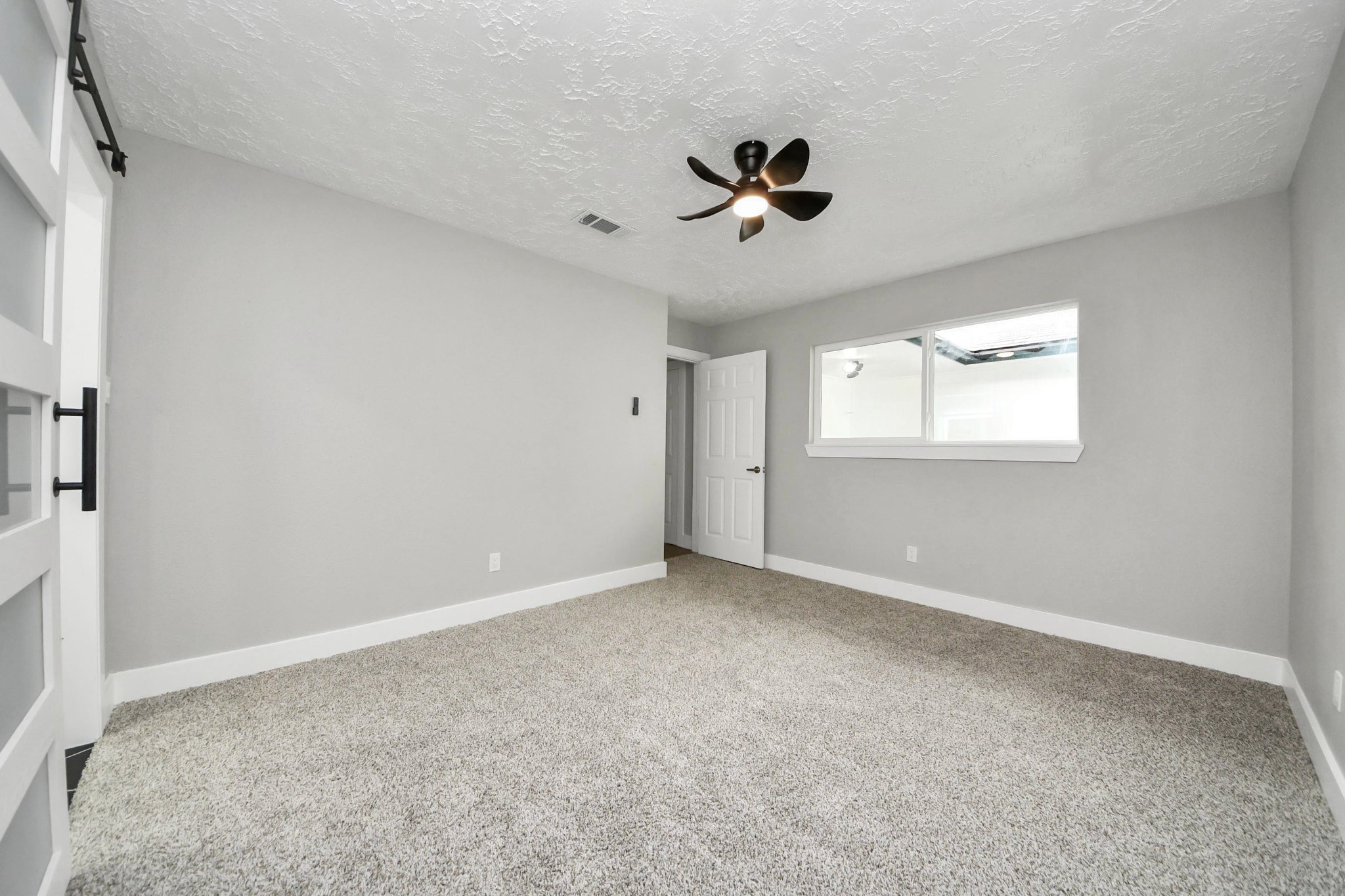 20010 Cottonglade Lane Humble, TX 77338 - Photo 11 of 27 a view of an empty room with a window