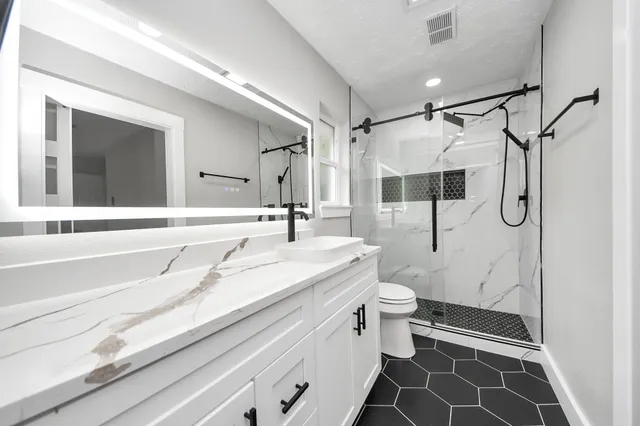 a view of an empty room with a closet