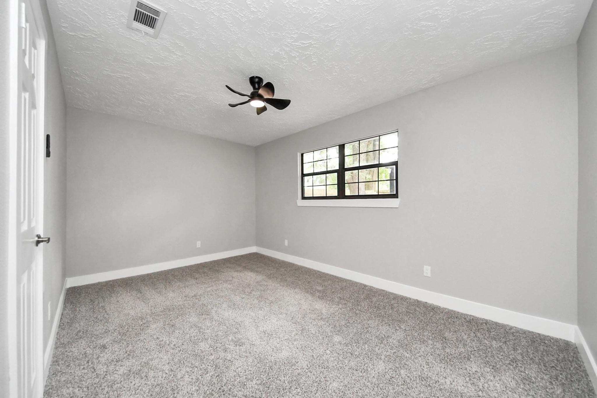 20010 Cottonglade Lane Humble, TX 77338 - Photo 16 of 27 a view of room with a ceiling fan and window