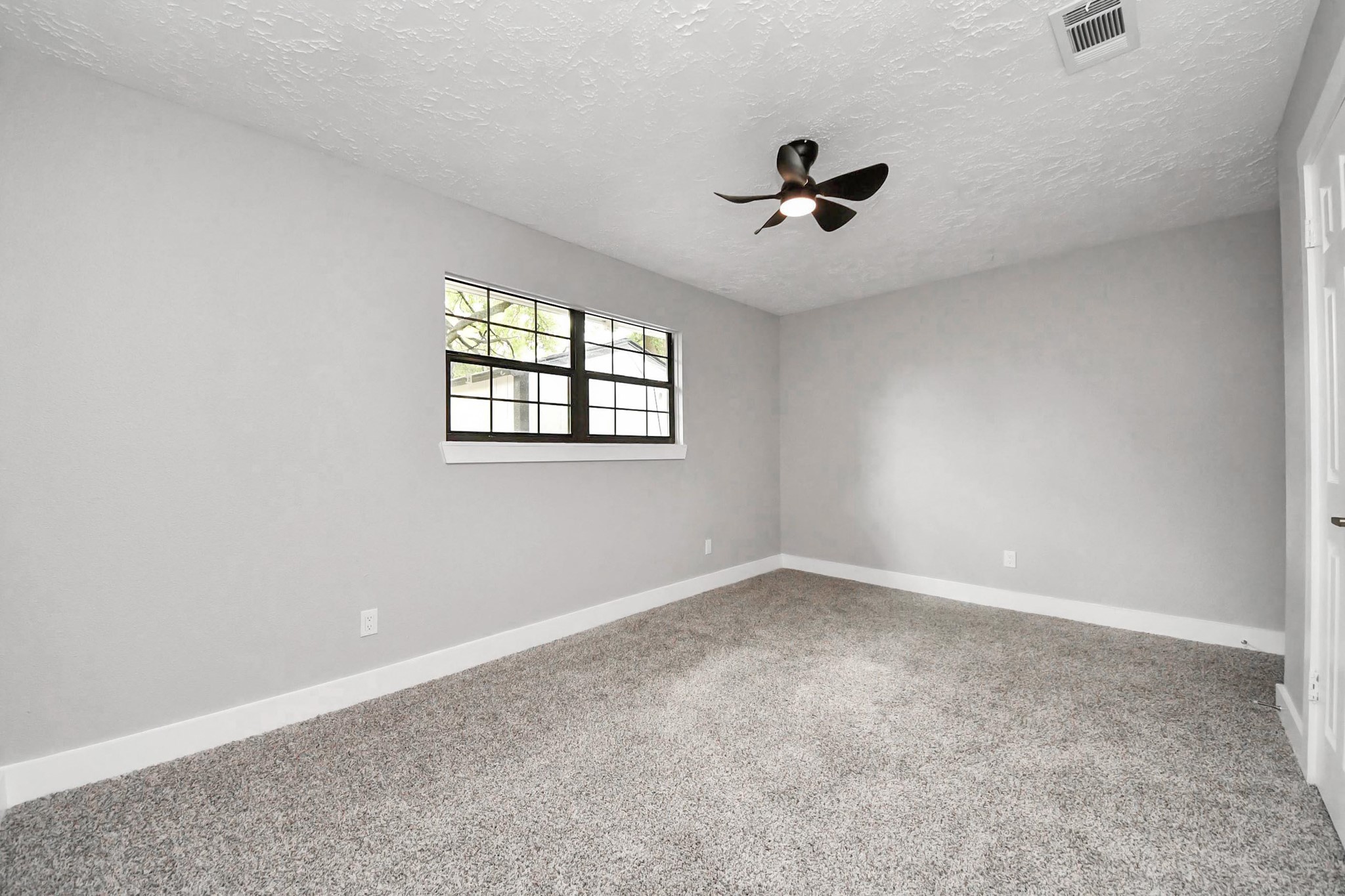 20010 Cottonglade Lane Humble, TX 77338 - Photo 17 of 27 wooden floor in an empty room with a window