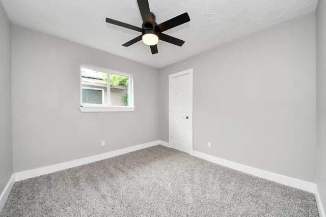 a bathroom with a shower toilet and sink