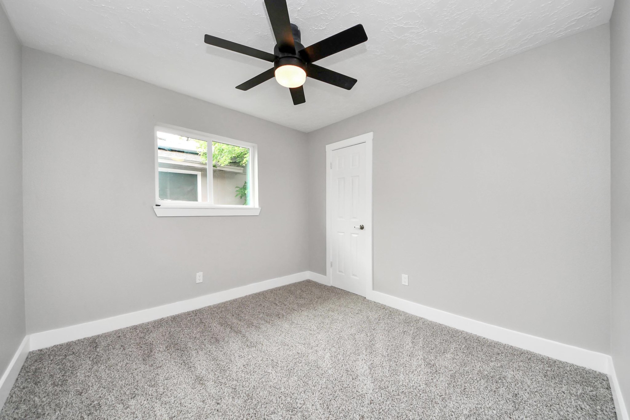 20010 Cottonglade Lane Humble, TX 77338 - Photo 20 of 27 an empty room with windows and fan