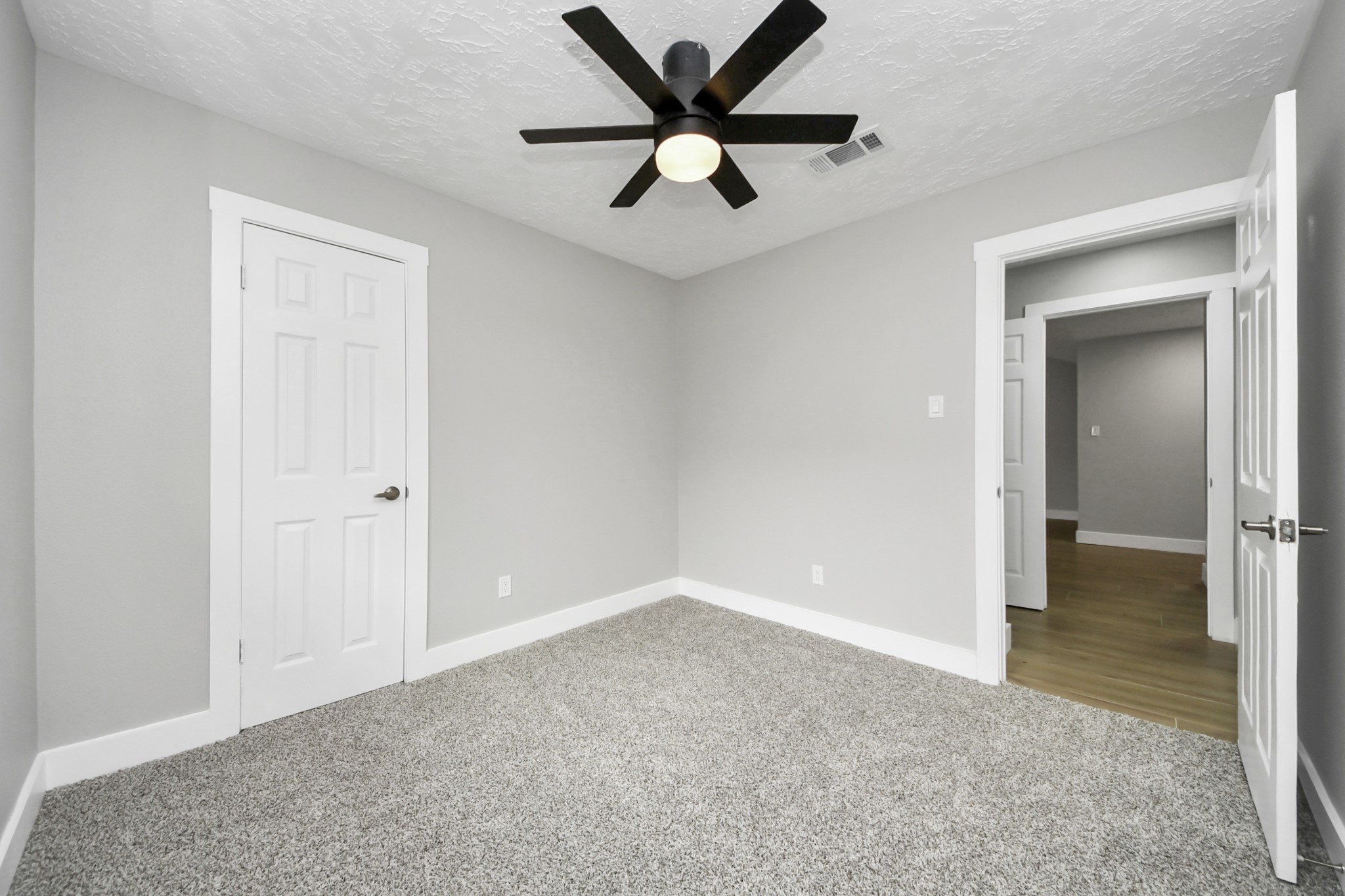 20010 Cottonglade Lane Humble, TX 77338 - Photo 21 of 27 an empty room that has a window and a ceiling fan