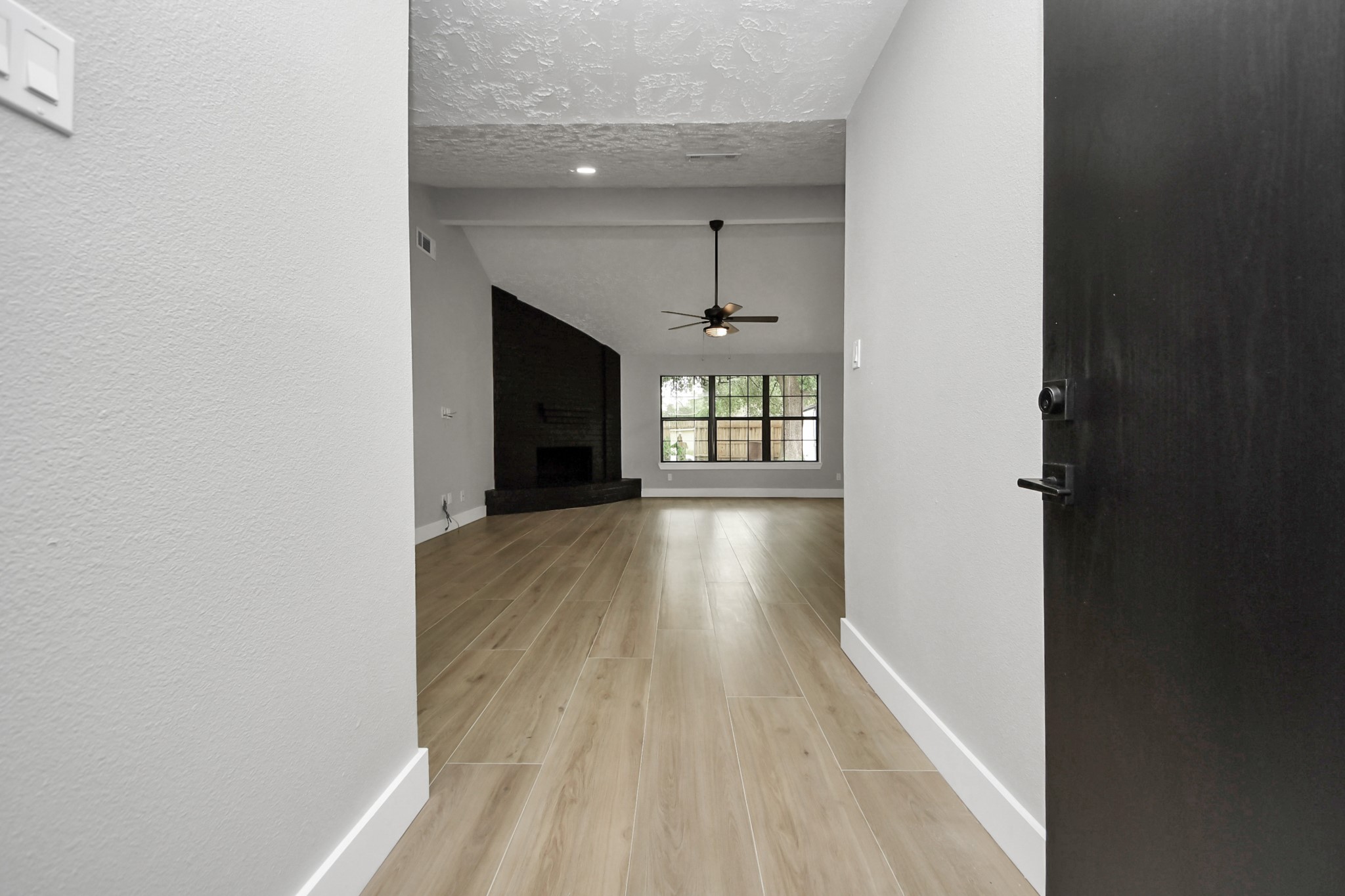 20010 Cottonglade Lane Humble, TX 77338 - Photo 4 of 27 a view of entryway and hall with wooden floor