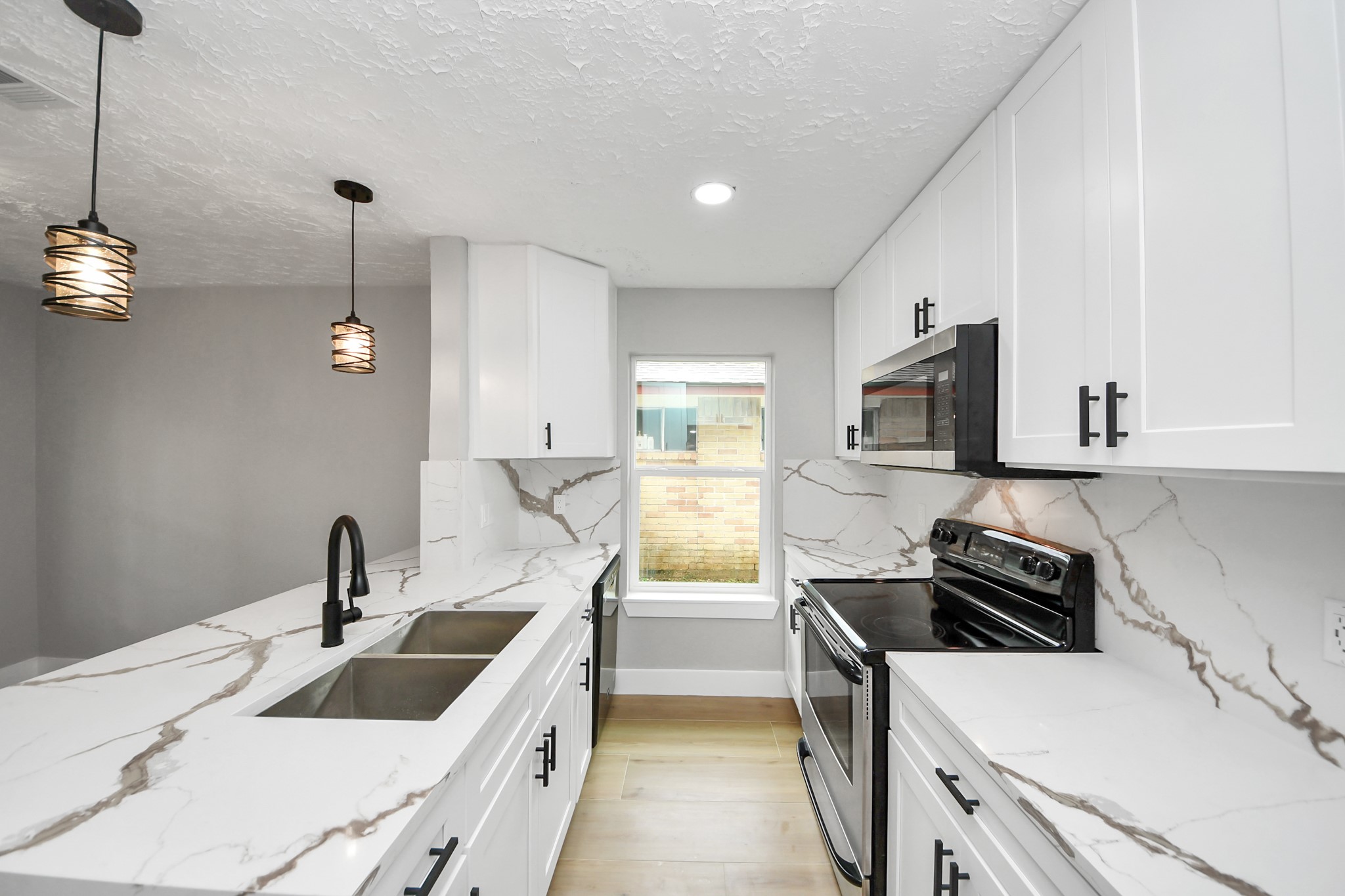 20010 Cottonglade Lane Humble, TX 77338 - Photo 7 of 27 a kitchen that has a sink and a stove