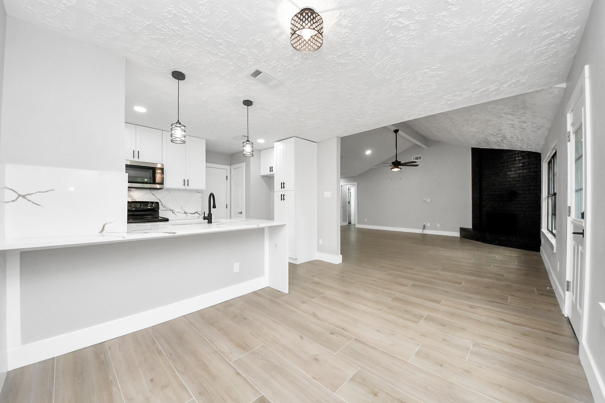 20010 Cottonglade Lane Humble, TX 77338 - Photo 9 of 27 a view of a kitchen with a sink and cabinets