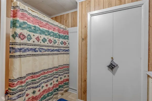 a rug with a painting on the wall