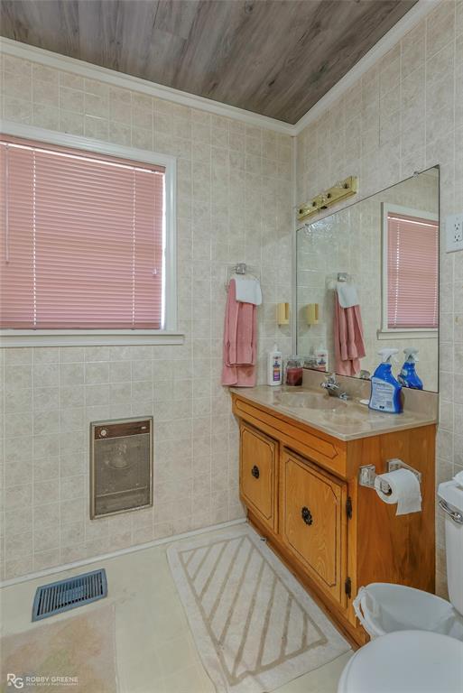 114 Quail Trail Homer, LA 71040 - Photo 28 of 40 a bathroom with a sink mirror and vanity