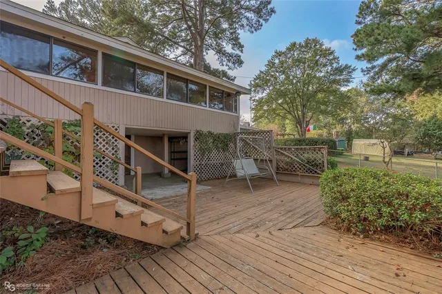 a view of a house with a yard and sitting area