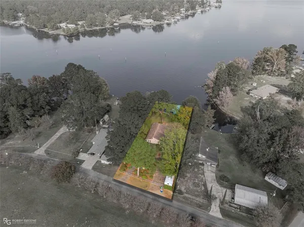 an aerial view of a house with a lake view