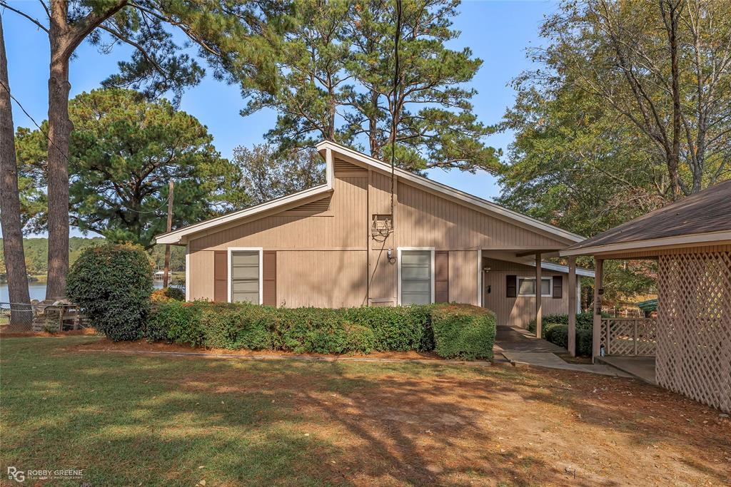 114 Quail Trail Homer, LA 71040 - Photo 8 of 40 a front view of a house with garden