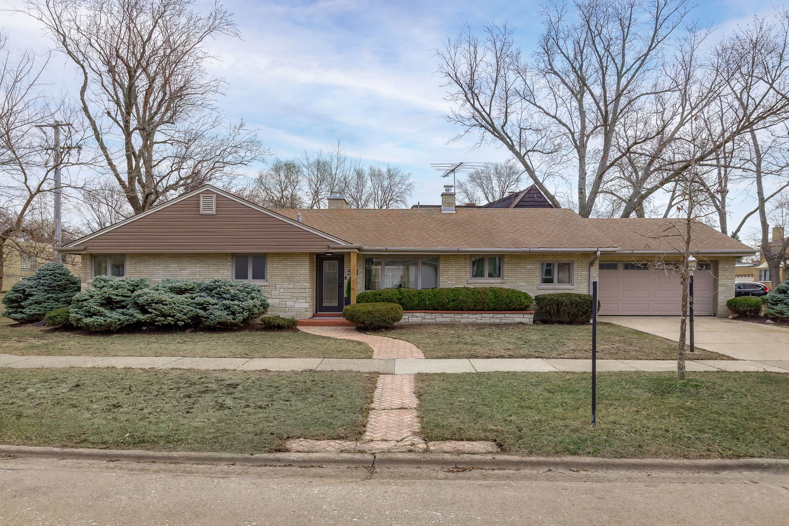 501 Byrd Road Riverside, IL 60546 - Photo 1 of 29 a front view of a house with garden