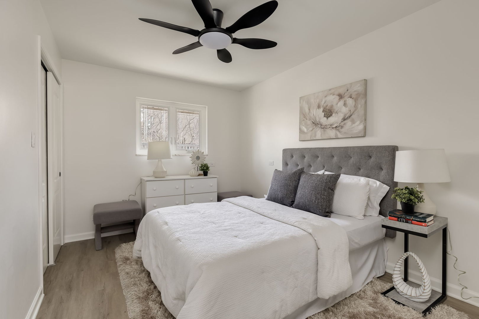 501 Byrd Road Riverside, IL 60546 - Photo 21 of 29 a bedroom with a bed and a chandelier