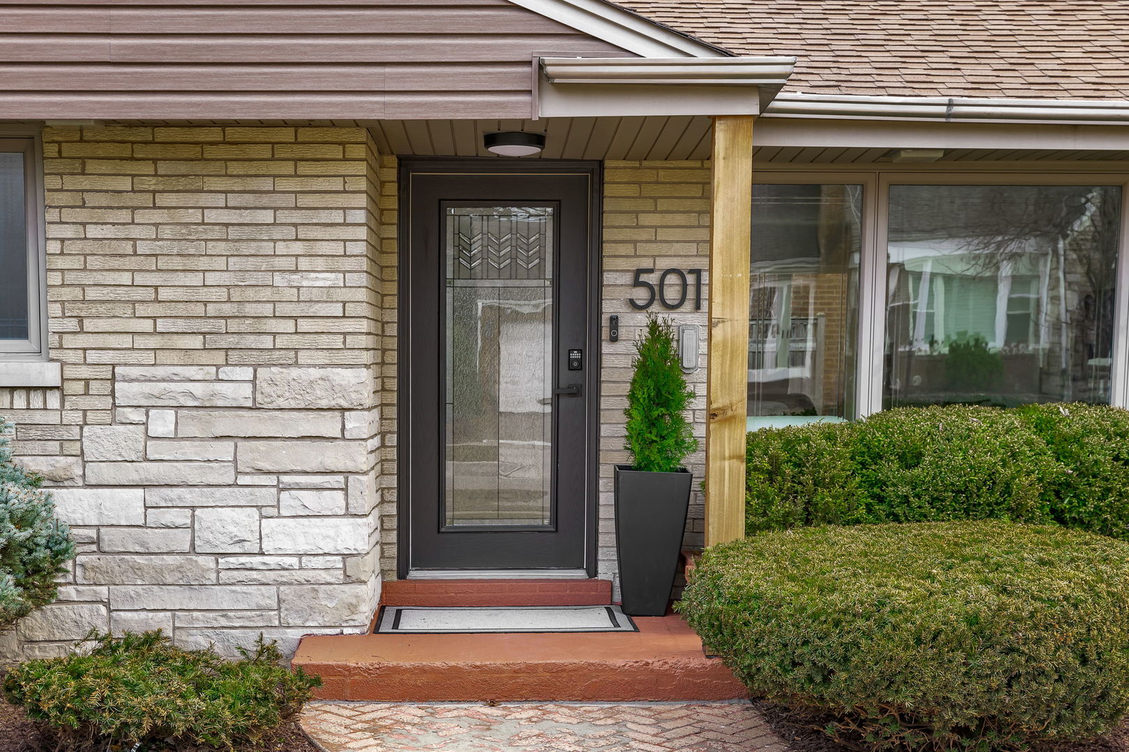 501 Byrd Road Riverside, IL 60546 - Photo 3 of 29 a front view of a house with a garden