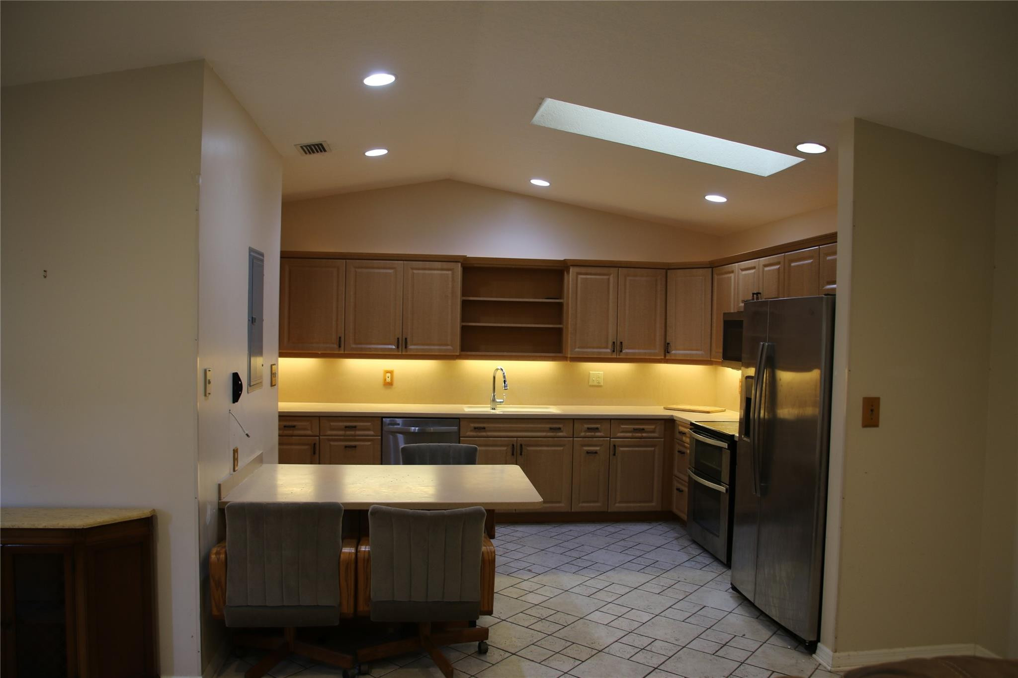 1433 Captains Walk, Unit C Fort Pierce, FL 34950 - Photo 2 of 11 a large kitchen with stainless steel appliances a large counter top