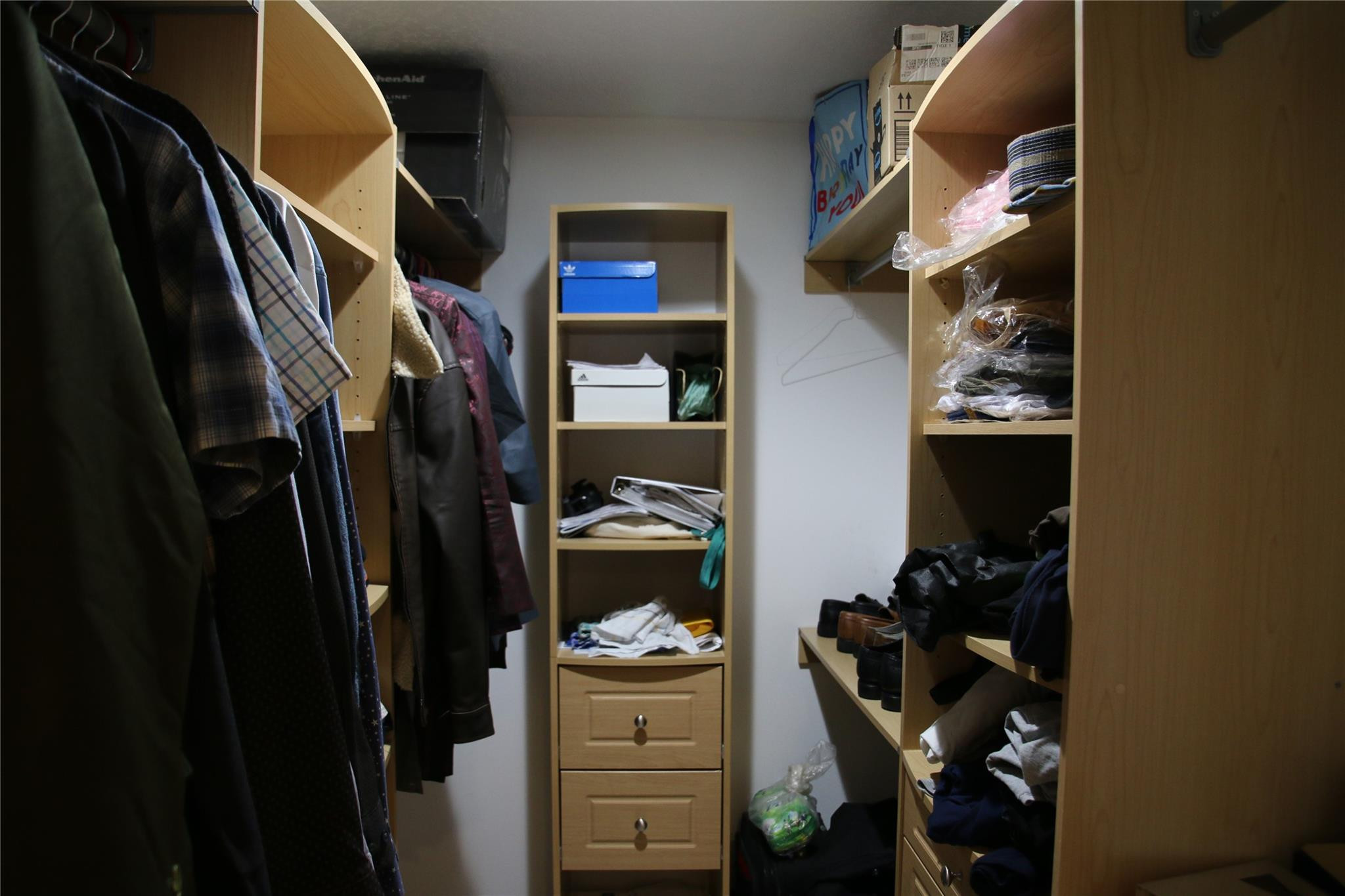 1433 Captains Walk, Unit C Fort Pierce, FL 34950 - Photo 7 of 11 a view of walk in closet with clothes and shoes