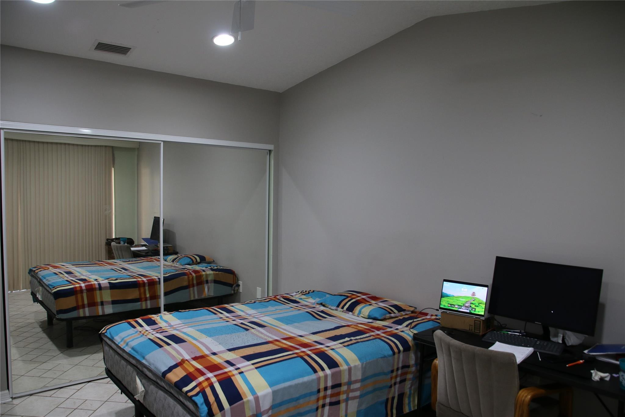 1433 Captains Walk, Unit C Fort Pierce, FL 34950 - Photo 8 of 11 a bedroom with bed and a tv