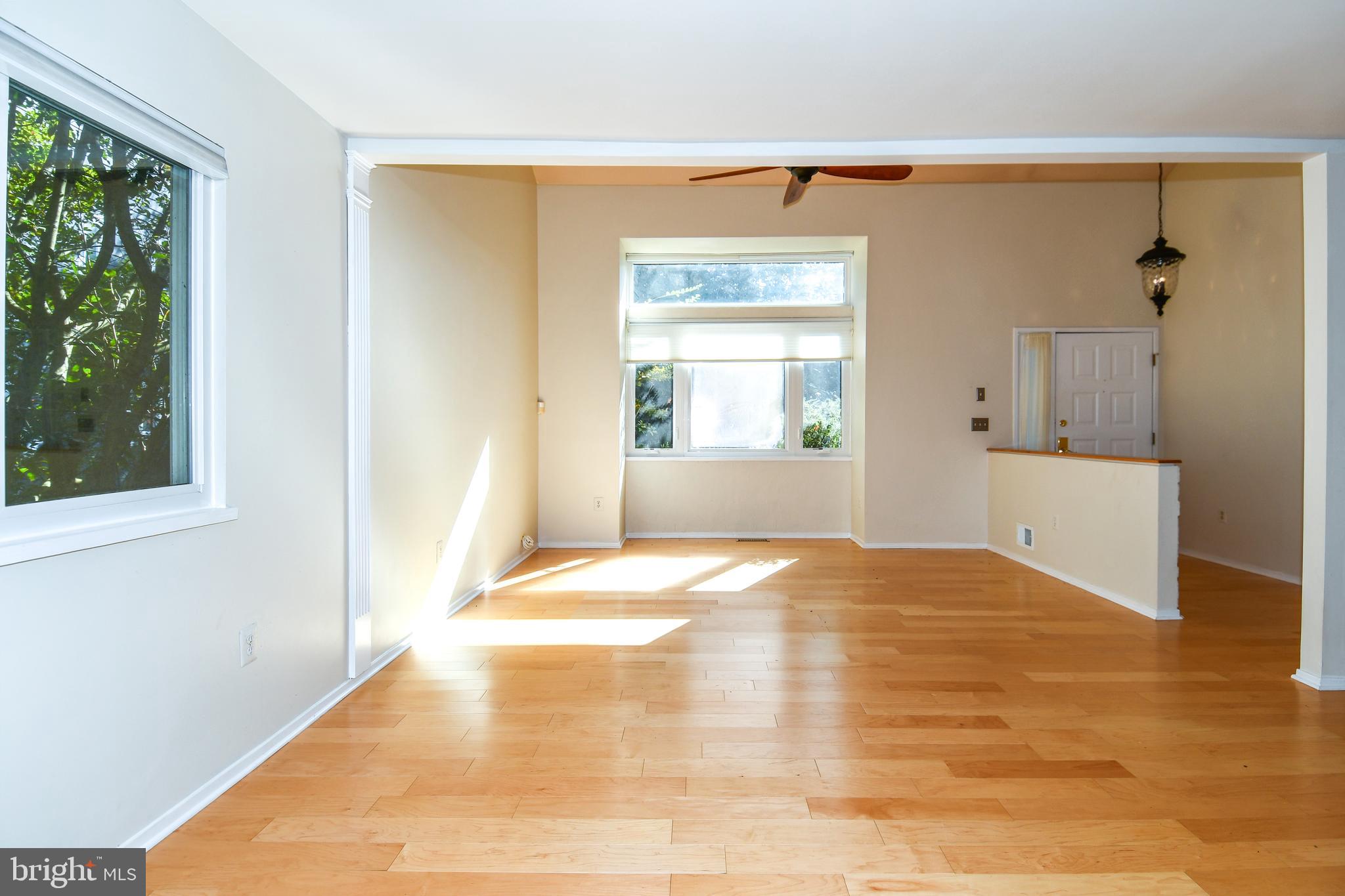 39 Windwhisper Lane Annapolis, MD 21403 - Photo 49 of 64 a view of empty room with wooden floor and windows