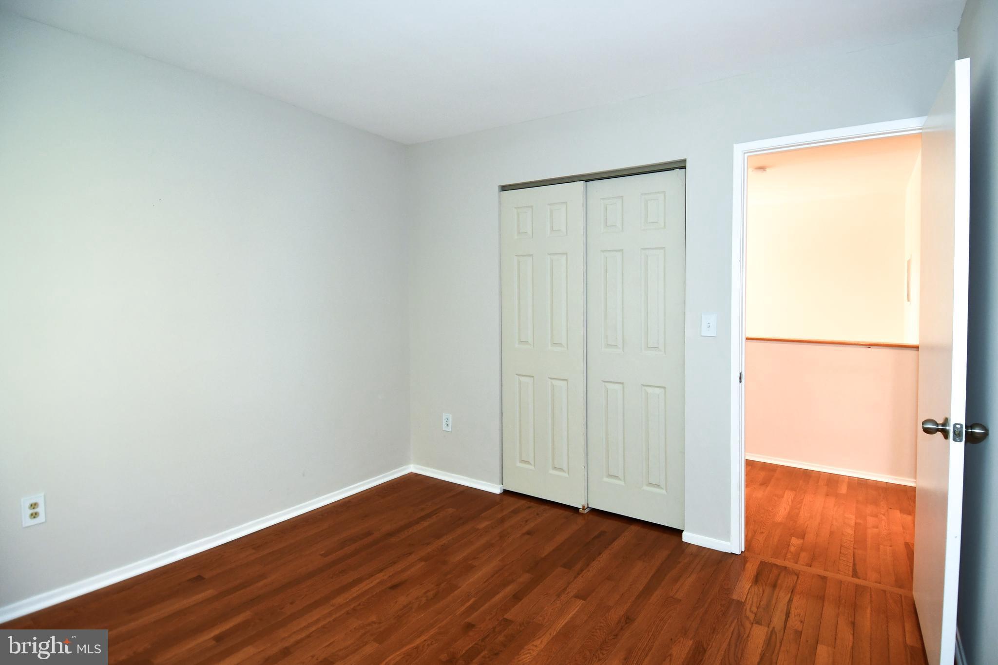 39 Windwhisper Lane Annapolis, MD 21403 - Photo 54 of 64 an empty room with wooden floor