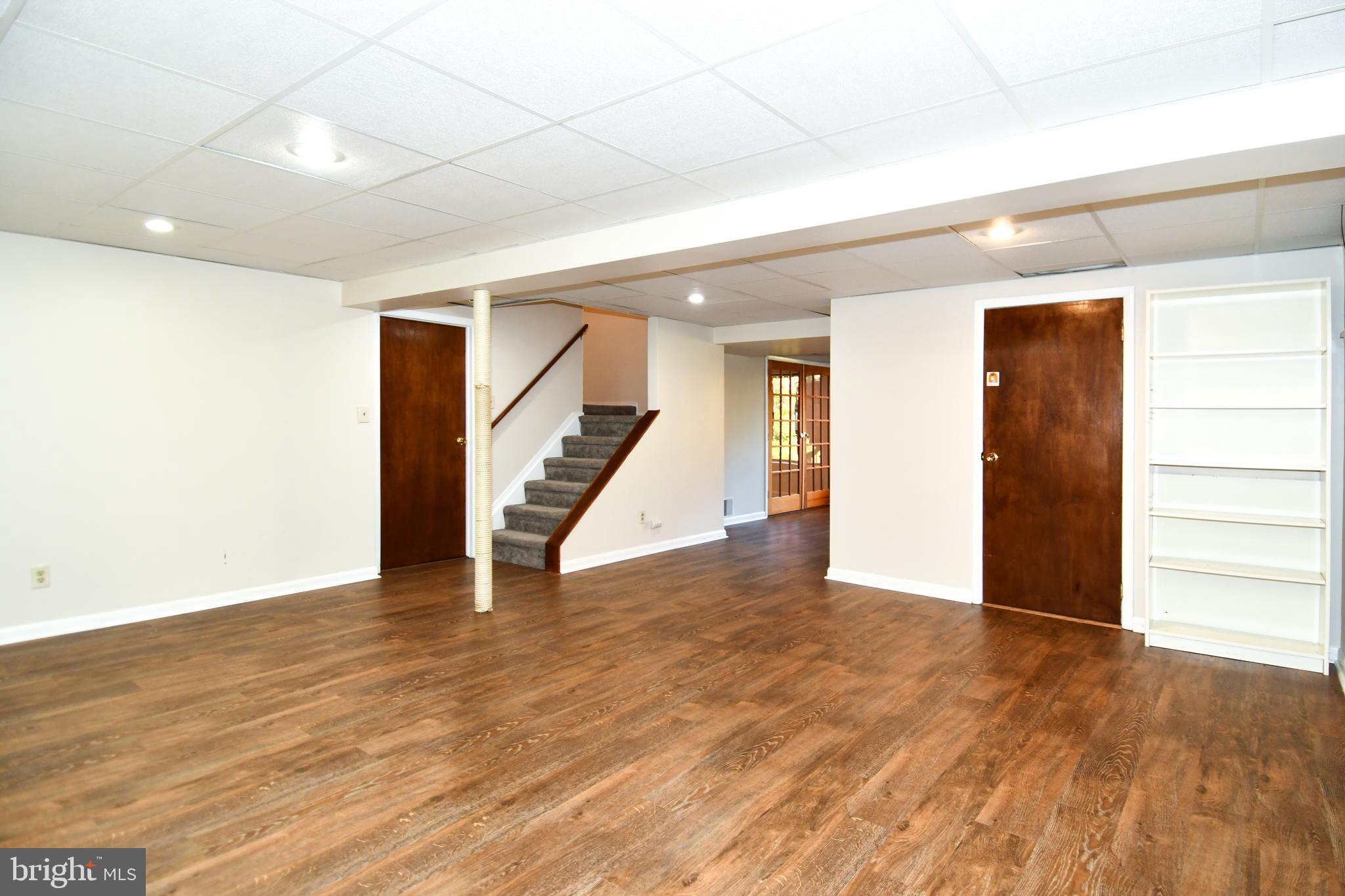 39 Windwhisper Lane Annapolis, MD 21403 - Photo 55 of 64 a view of an empty room with wooden floor