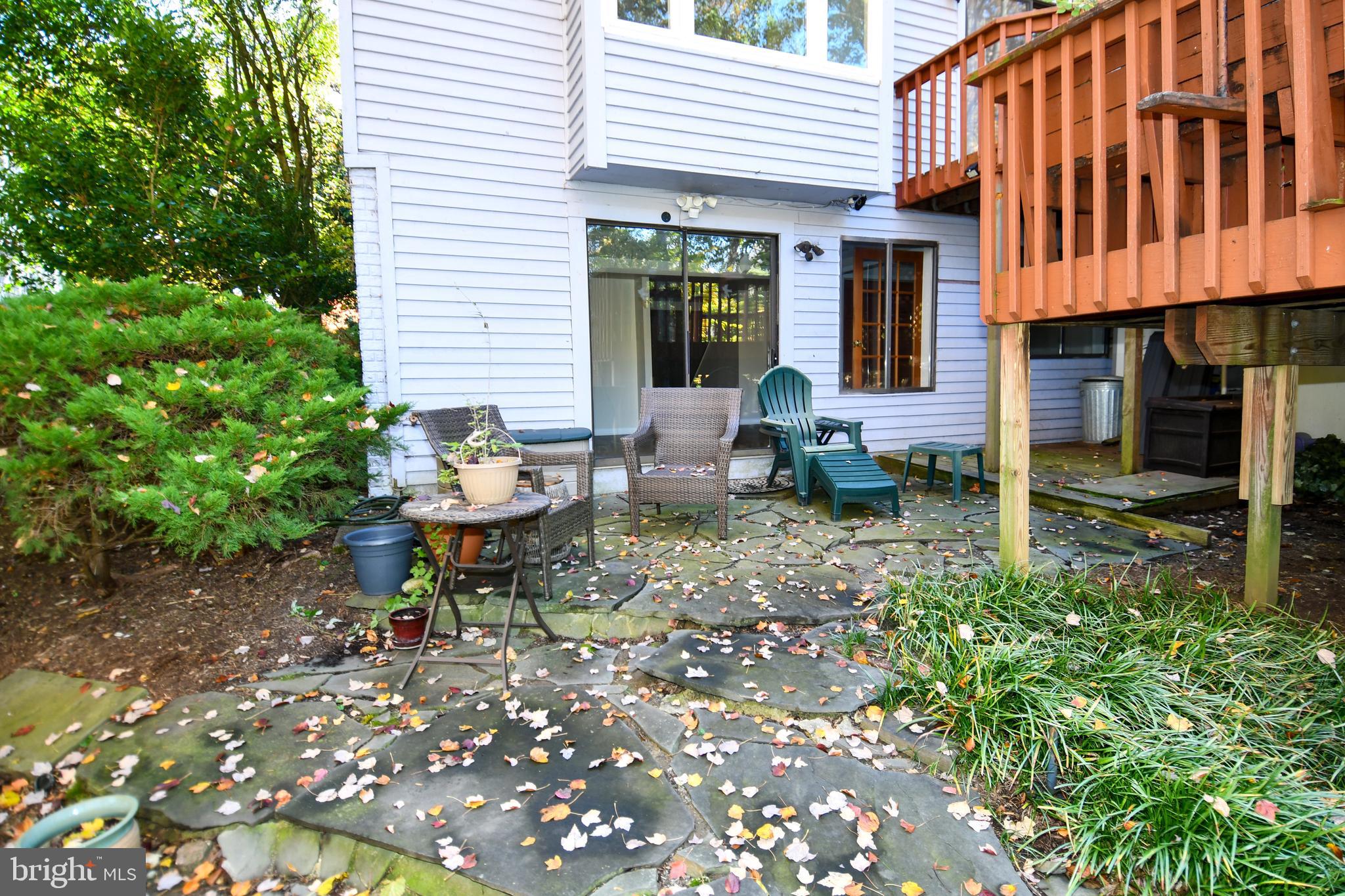 39 Windwhisper Lane Annapolis, MD 21403 - Photo 57 of 64 a chair and table in front of a house