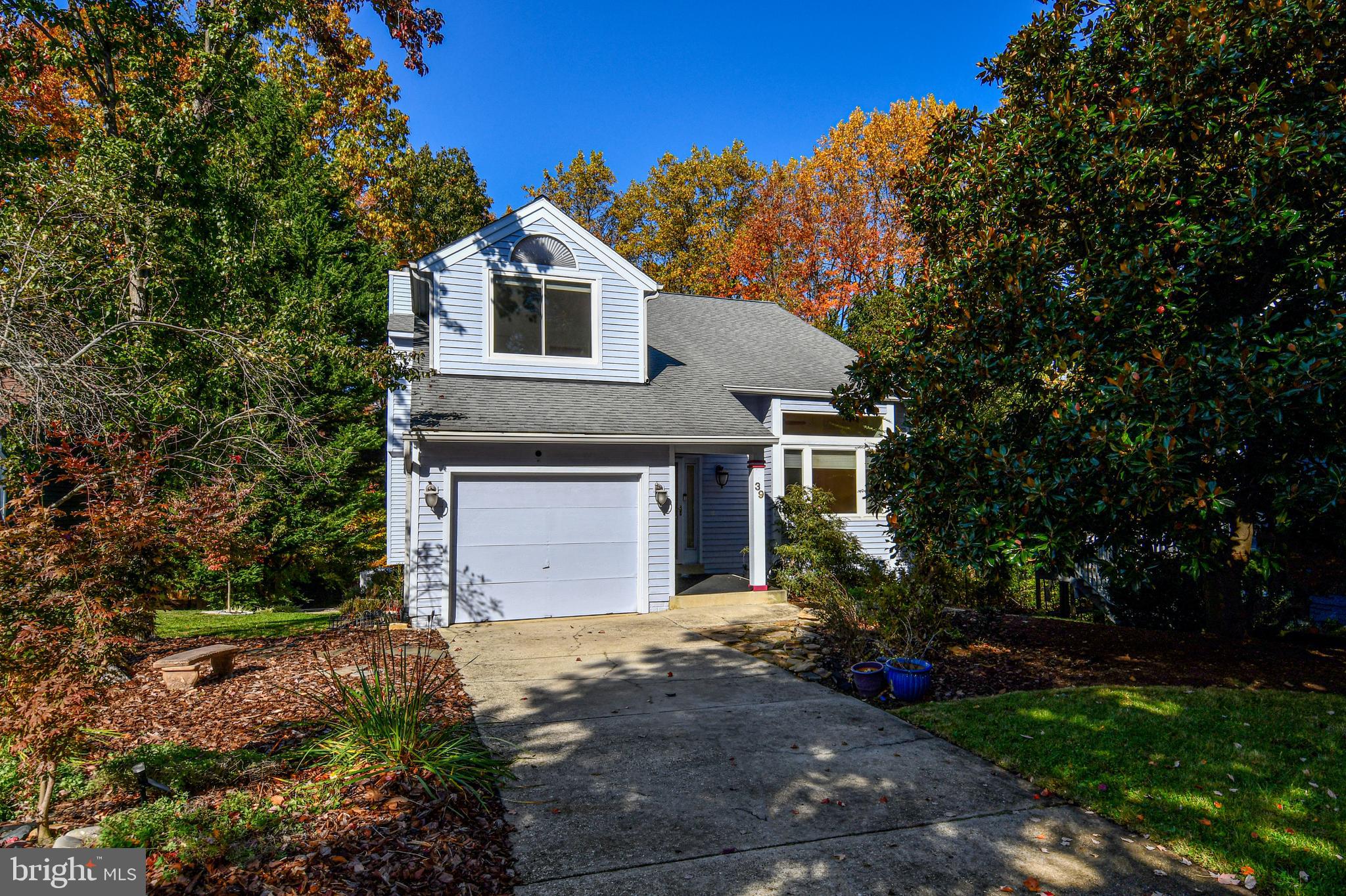 39 Windwhisper Lane Annapolis, MD 21403 - Photo 62 of 64 a front view of a house with a garden