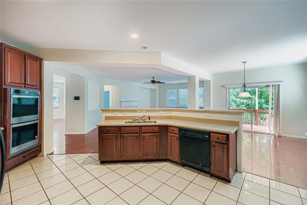 700 Kirkly Way Fairburn, GA 30213 - Photo 13 of 31 a kitchen with stainless steel appliances granite countertop a stove and a sink