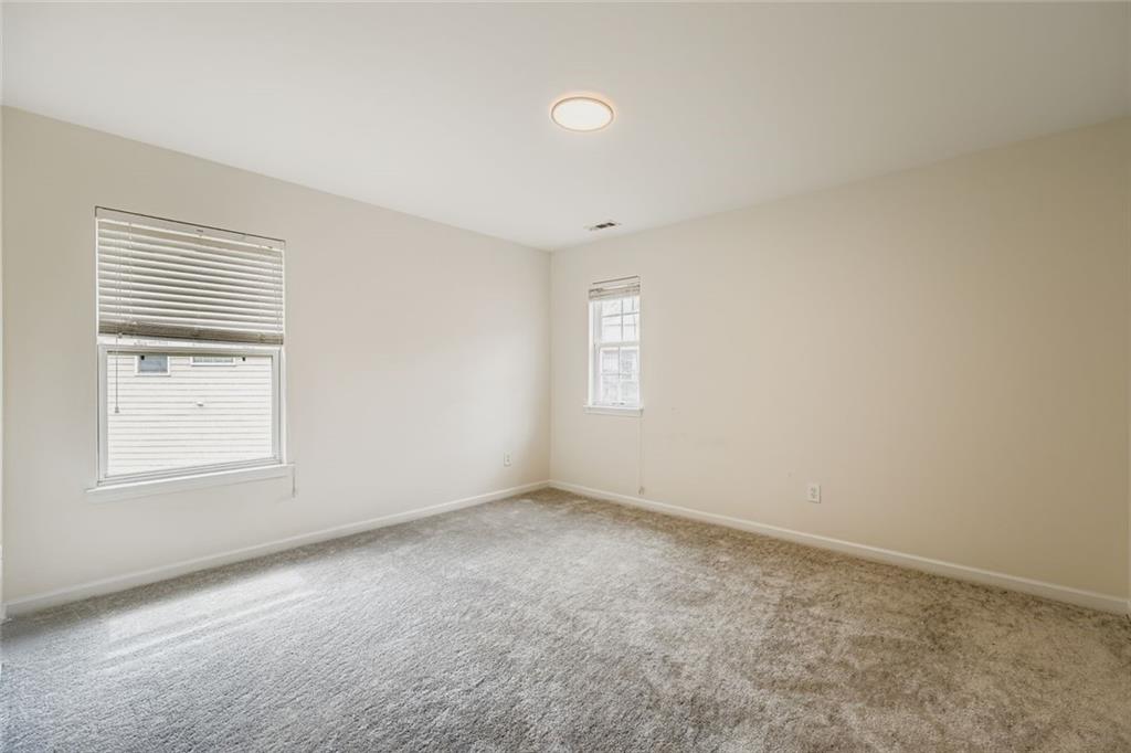 700 Kirkly Way Fairburn, GA 30213 - Photo 21 of 31 an empty room with windows
