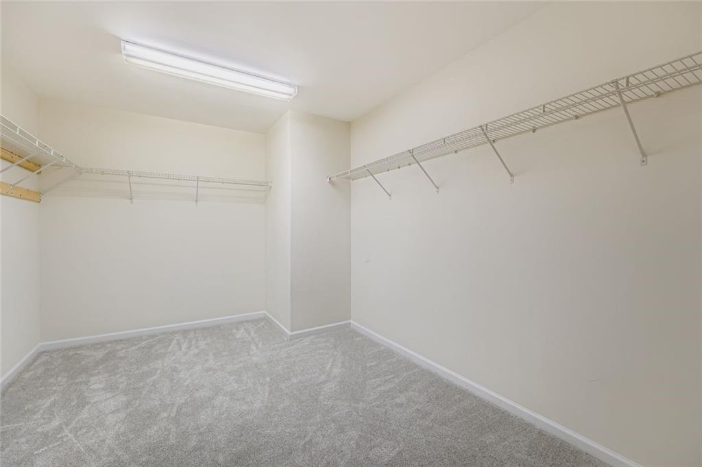 700 Kirkly Way Fairburn, GA 30213 - Photo 22 of 31 a view of a room with racks on the wall