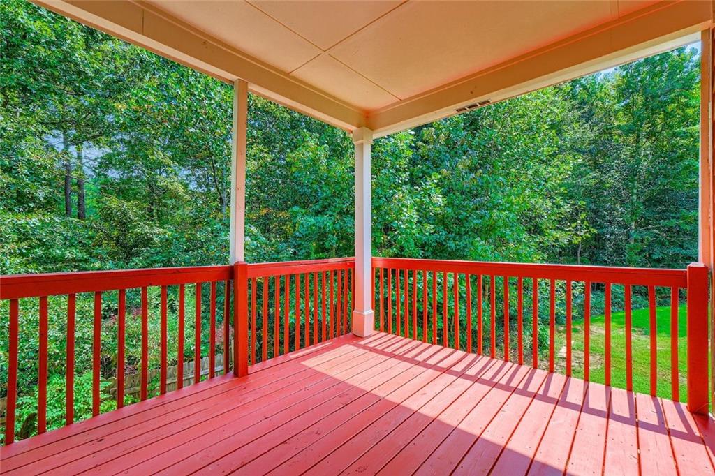 700 Kirkly Way Fairburn, GA 30213 - Photo 28 of 31 a balcony with wooden floor and outdoor space