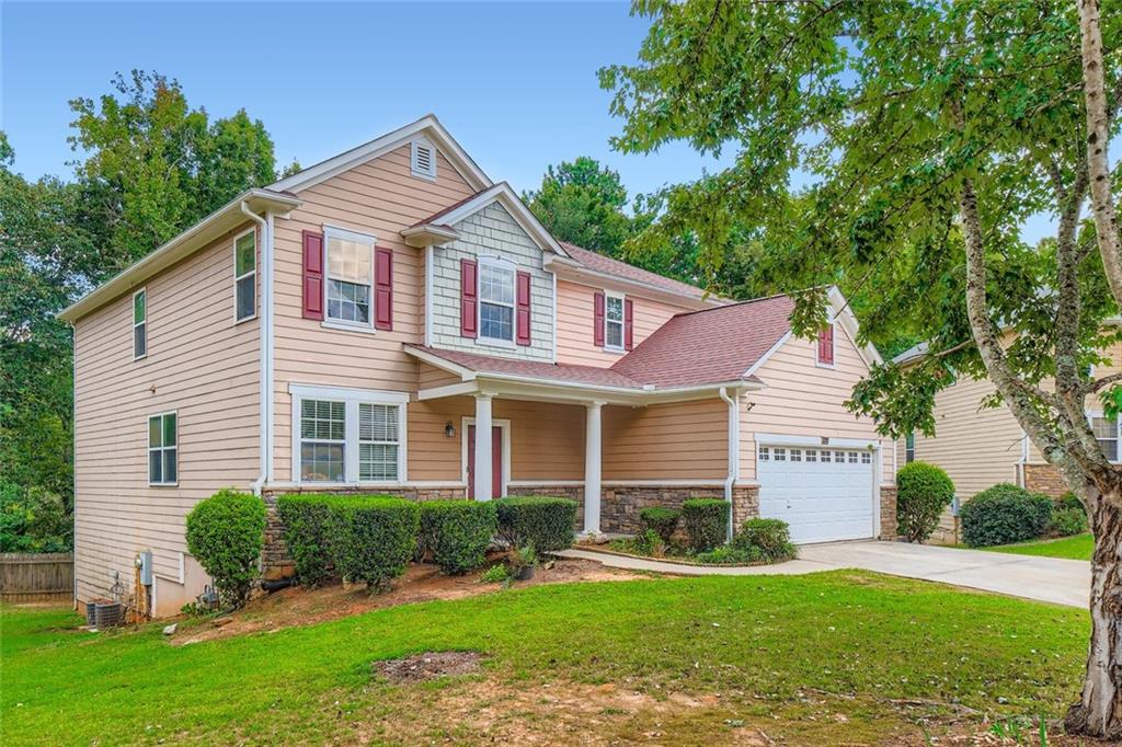 700 Kirkly Way Fairburn, GA 30213 - Photo 31 of 31 a front view of a house with a yard and garage
