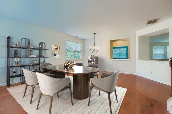 700 Kirkly Way Fairburn, GA 30213 - Photo 5 of 31 a view of a dining room with furniture and a wooden floor