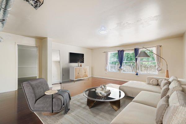 700 Kirkly Way Fairburn, GA 30213 - Photo 6 of 31 a living room with furniture and a large window
