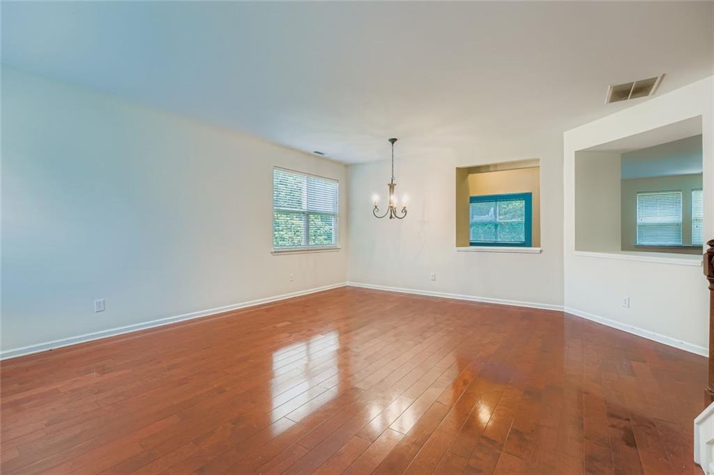 700 Kirkly Way Fairburn, GA 30213 - Photo 9 of 31 an empty room with windows