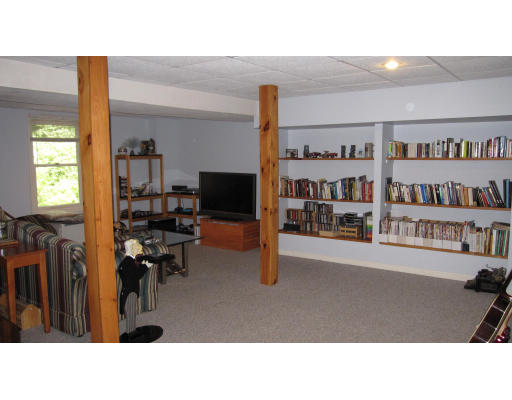 61 Clark Road Sturbridge, MA 01518 - Photo 11 of 17 a living room with furniture and a flat screen tv