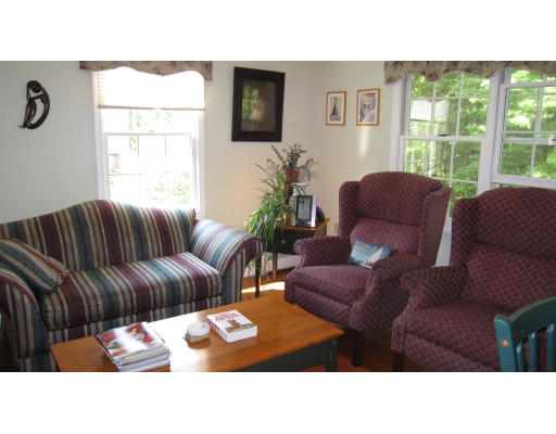 61 Clark Road Sturbridge, MA 01518 - Photo 6 of 17 a living room with furniture and a window