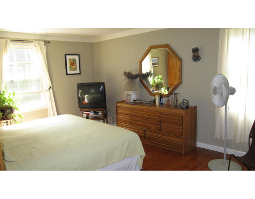 61 Clark Road Sturbridge, MA 01518 - Photo 7 of 17 a room with a bed a mirror on desk and a window