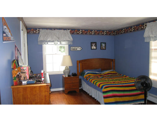 61 Clark Road Sturbridge, MA 01518 - Photo 9 of 17 a living room with a couch and a window