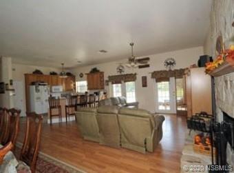 415 Stacy Grove Road Oak Hill, FL 32759 - Photo 11 of 25 a view of a living room and kitchen