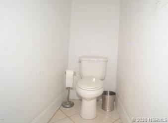 415 Stacy Grove Road Oak Hill, FL 32759 - Photo 18 of 25 a white toilet sitting next to a white wall