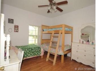 415 Stacy Grove Road Oak Hill, FL 32759 - Photo 20 of 25 a dining room with furniture and window