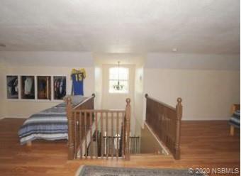 415 Stacy Grove Road Oak Hill, FL 32759 - Photo 23 of 25 a view of a hallway with staircase