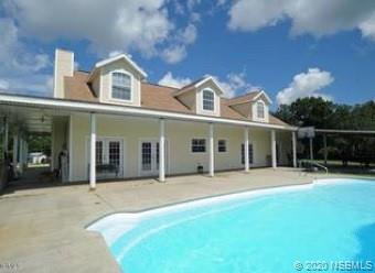 415 Stacy Grove Road Oak Hill, FL 32759 - Photo 4 of 25 a front view of a house with a yard